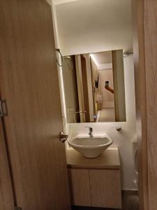 a bathroom with a sink and a mirror at Barranquero Coffee Loft in Santa Rosa de Cabal +7 photos