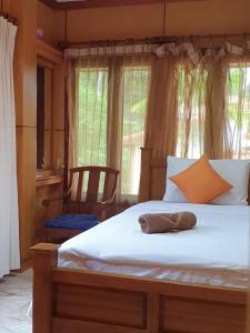 a bedroom with a large white bed and a window at Thai House by Dow Residence in Lamai +17 photos