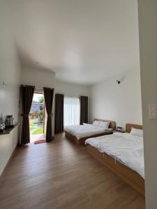 Postel nebo postele na pokoji v ubytování Vy's Home Homestay Mũi Né