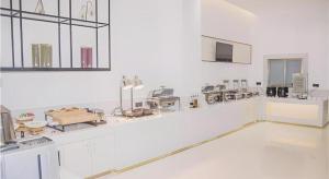 a large white laboratory with many equipment in it at City Comfort Inn Wanning Wan'An Avenue High Speed Railway Station in Wanning