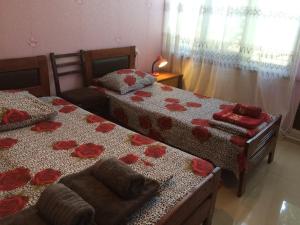 Ein Bett oder Betten in einem Zimmer der Unterkunft Alex's Cosy Guesthouse