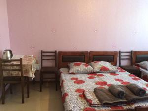 Ein Bett oder Betten in einem Zimmer der Unterkunft Alex's Cosy Guesthouse