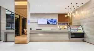 TV a/nebo společenská místnost v ubytování City Comfort Inn Nanning Jiangnan Wanda Plaza