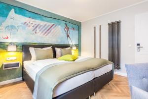 Postel nebo postele na pokoji v ubytování Burghotel Lingen
