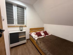 Postel nebo postele na pokoji v ubytování Domek Matyjówka