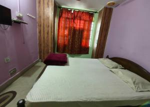 Postel nebo postele na pokoji v ubytování Hotel O B. S Marriage Palace