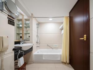 Ванная комната в Guangdong Hotel