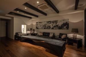 a living room with a couch and a table at Rairin in Hiroshima