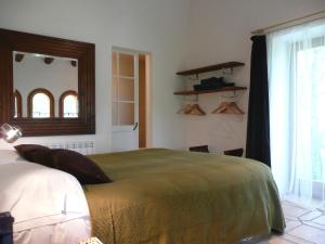 Postel nebo postele na pokoji v ubytování Casa Argentera