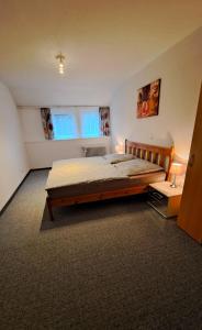 Postel nebo postele na pokoji v ubytování Ferienwohnung Auguste