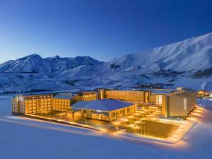 a rendering of a building with mountains in the background at Conrad Altay Hemu in K'u-mu