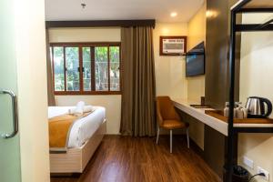 Ένα ή περισσότερα κρεβάτια σε δωμάτιο στο Hollywood Hotel Palawan
