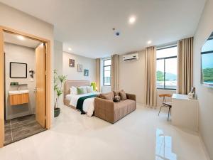 Postel nebo postele na pokoji v ubytování Sol Park View Hotel Phú Mỹ