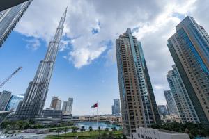 a view of a city with tall buildings at Vogue Vacation Homes, Downtown Opera Grand near Burj Khalifa and Dubai Mall, Two Bedroom Apartment with Large Balcony and Burj Khalifa view, Access to all Amenities in Dubai