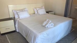 Giường trong phòng chung tại Vista Alta Serma