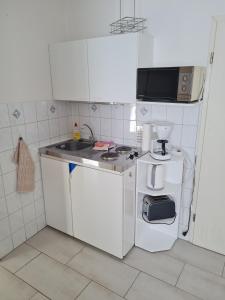 Kuchyň nebo kuchyňský kout v ubytování Ferienwohnung Ribnitz-Damgarten + 2 fotografie