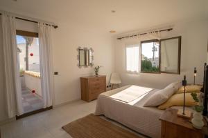 Ένα ή περισσότερα κρεβάτια σε δωμάτιο στο Llenaire Gran Beach House