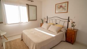 Ένα ή περισσότερα κρεβάτια σε δωμάτιο στο Llenaire Gran Beach House +9 φωτογραφίες