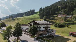 a large building in the middle of a mountain at Das Filzmoos in Filzmoos