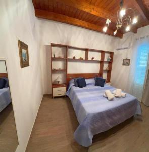 Postel nebo postele na pokoji v ubytování Casa Del Pescatore