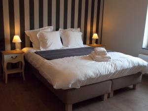 Postel nebo postele na pokoji v ubytování Hotel Vorsen
