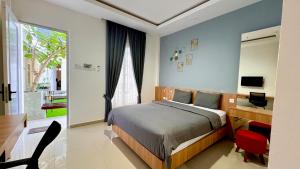 TV a/nebo společenská místnost v ubytování studio suryajingga