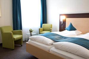 Voodi või voodid majutusasutuse Hotel Buchserhof toas