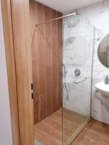 a glass shower in a bathroom with a sink at Apartment B45 Borovets Gardans in Borovets +11 photos