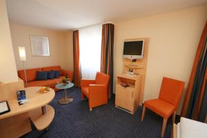 Televiisor ja/või meelelahutuskeskus majutusasutuses Hotel Buchserhof