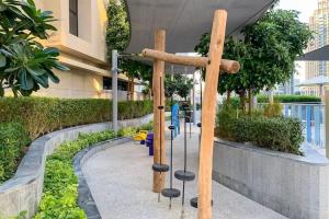 a wooden cross with chairs in a building at Vogue Vacation Homes, Downtown Opera Grand near Burj Khalifa and Dubai Mall, Two Bedroom Apartment with Large Balcony and Burj Khalifa view, Access to all Amenities in Dubai