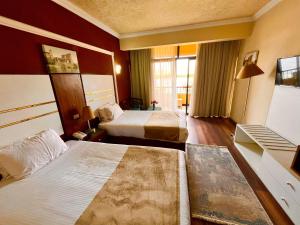 En eller flere senge i et værelse på Jewel Luxor Hotel Nile View + 65 billeder