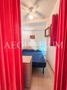 Giường trong phòng chung tại Pesciolino Rosso