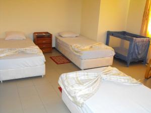 A bed or beds in a room at Hotel Lazareto
