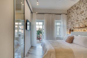 Giường trong phòng chung tại Nalia Suites