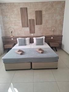 En eller flere senge i et værelse på Electra Beach Holiday Village