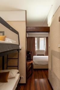 En eller flere senge i et værelse på WOT Porto Soul + 56 billeder