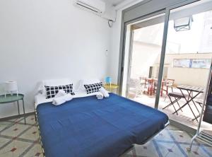 En eller flere senge i et værelse på La casa del Pi · La casa del Pi · House in the city, next to Barcelona and beach