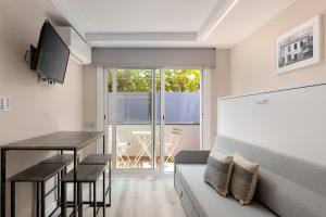 TV a/nebo společenská místnost v ubytování Aparthotel Vilassar