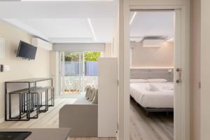 Postel nebo postele na pokoji v ubytování Aparthotel Vilassar + 76 fotografií