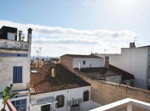 a view of roofs of buildings in a city at Can Josep in Vilassar de Mar
