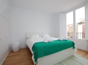 En eller flere senge i et værelse på The Painter's Home