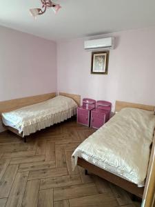 Postel nebo postele na pokoji v ubytování Albatros