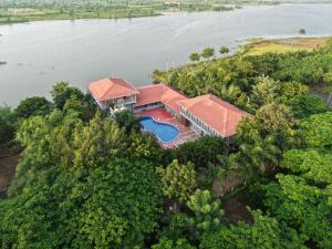 an aerial view of a house with a swimming pool at Neel Farms and Resort in Saoner