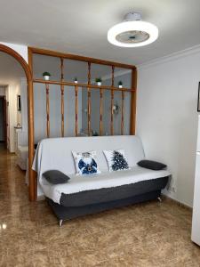 En eller flere senge i et værelse på Apartamento-Estudio en la Playa