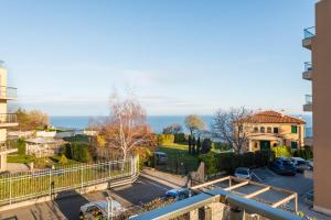 a view from a balcony of a house and a street at Didi`s Stylish Studio - Seaview & Pool Backyard in Varna City
