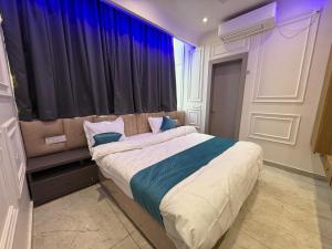 Ένα ή περισσότερα κρεβάτια σε δωμάτιο στο Hotel Mariott Inn