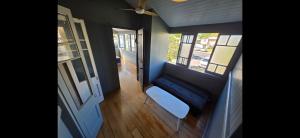 an empty room with a bench and a window at Buchan Street, Accommodation in East Trinity