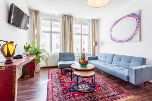 a living room with a couch and a table at GreatStay Apartment - Rheinsbergerstr. in Berlin