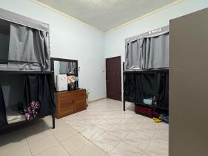 a room with two displays of a dressing room at Bed space for Budget Backpacker - No Parking in Abu Dhabi