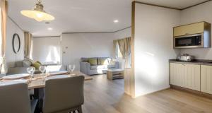 a kitchen and a living room with a table and chairs at Best Western Plus Kenwick Park Hotel in Louth +96 photos